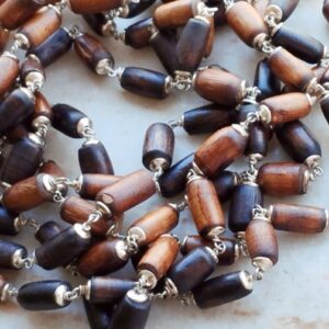 Cylindrical shaped silver capped tulsi beads japa mala with pretty guru bead like dollar
